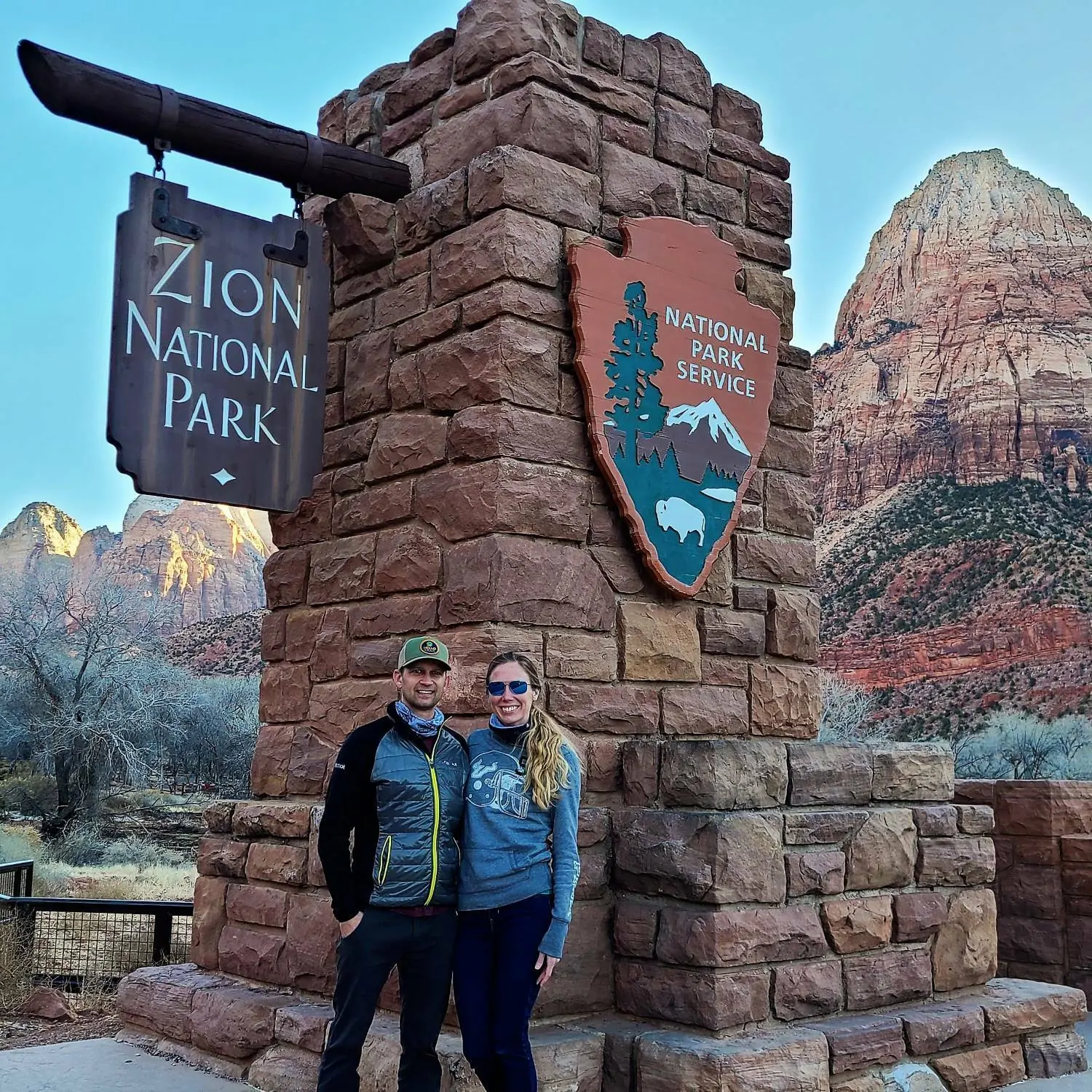 Andrew and Ashley, co-founders of Epic Today, at the entrance of Zion National Park
